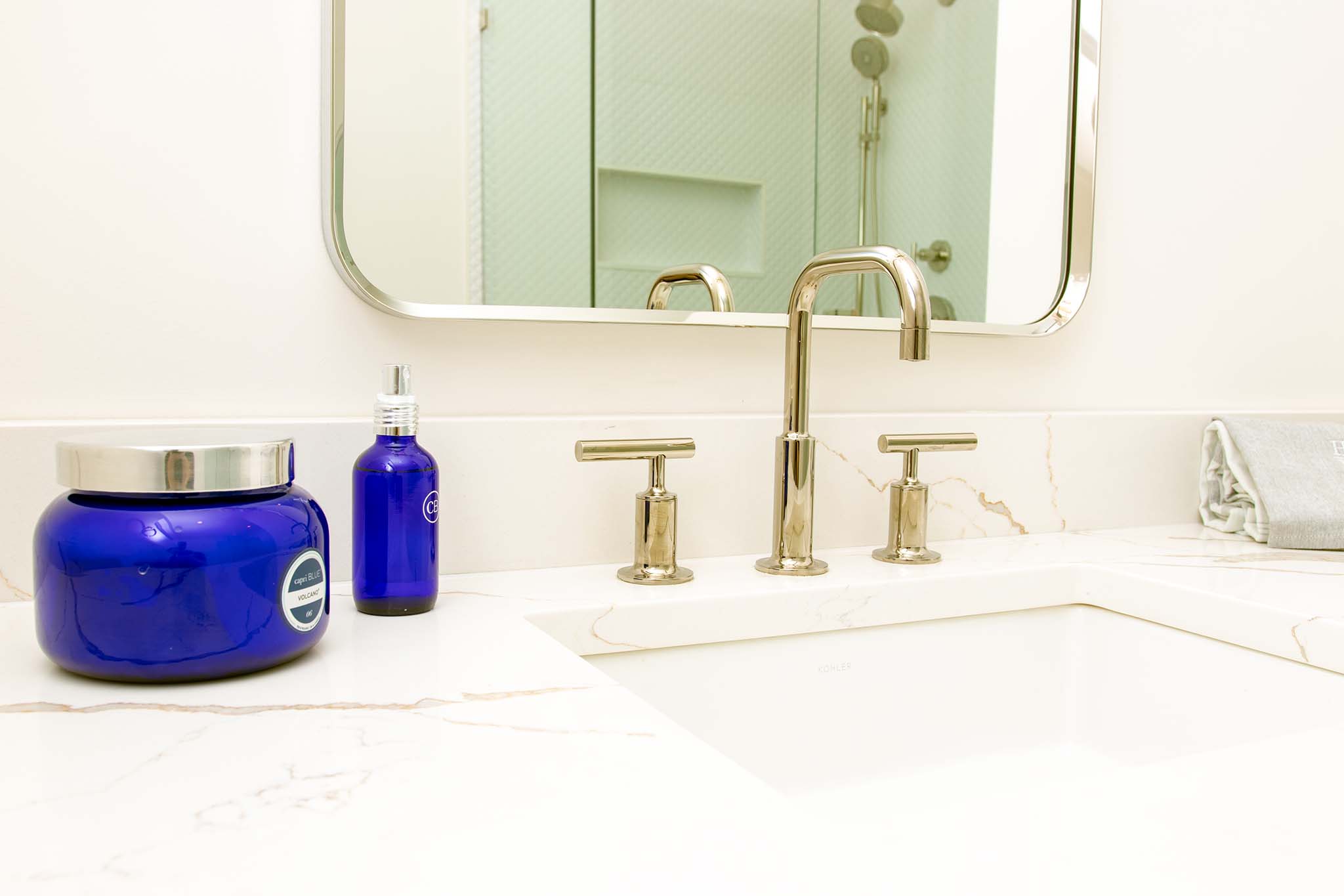 Clean and bright guest vanity setup, balancing modern design with classic New England simplicity.