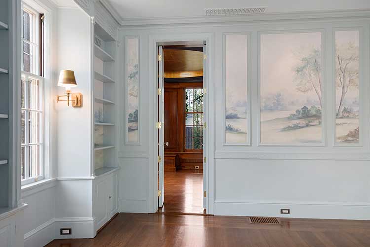 Elegant sitting room connecting to the primary bath, showcasing the seamless integration of new layouts in a 1931 home.