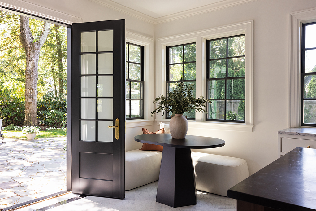 Cozy casual dining corner with a round table, perfect for morning coffee in this renovated estate.