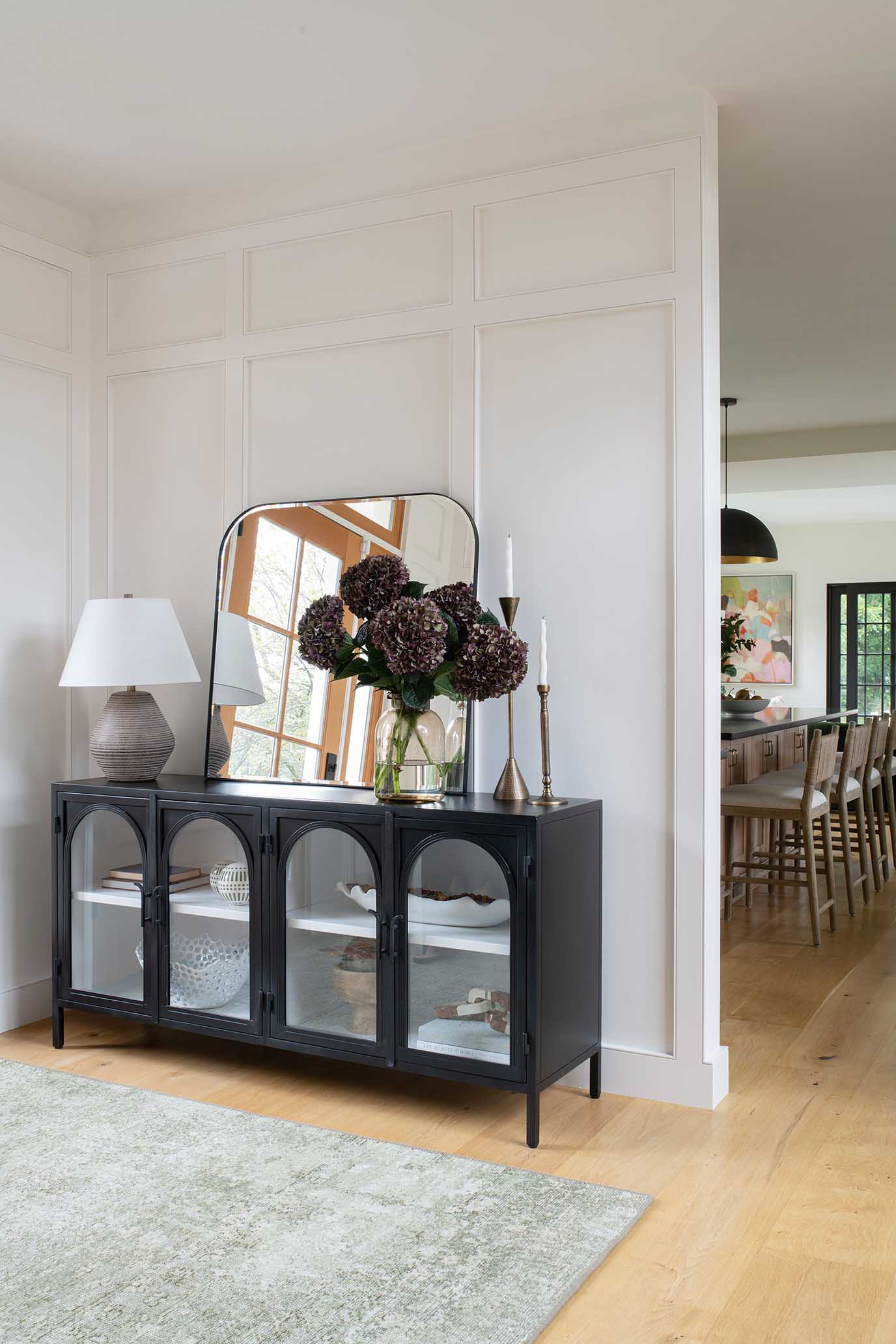 Dining area featuring custom built-in white oak cabinetry and organic modern styling.