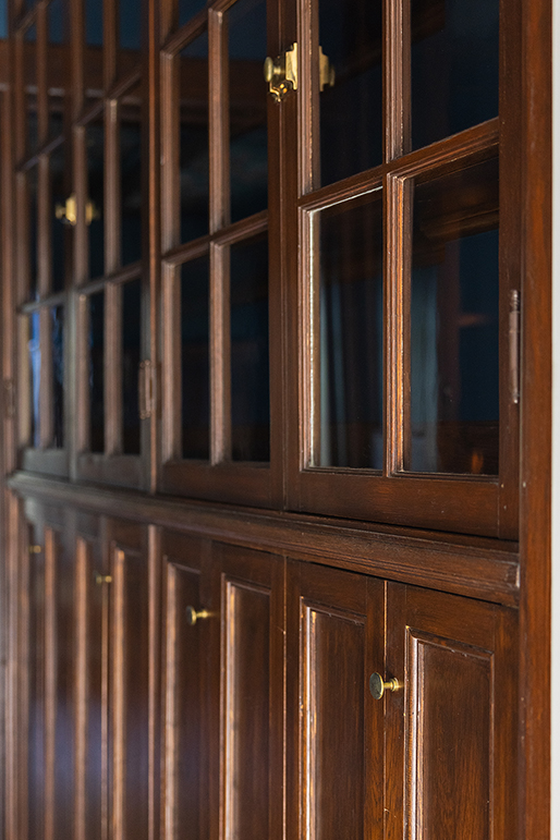 Detail of the restored glass-front cabinetry in the butler's pantry, perfect for displaying crystal and china.