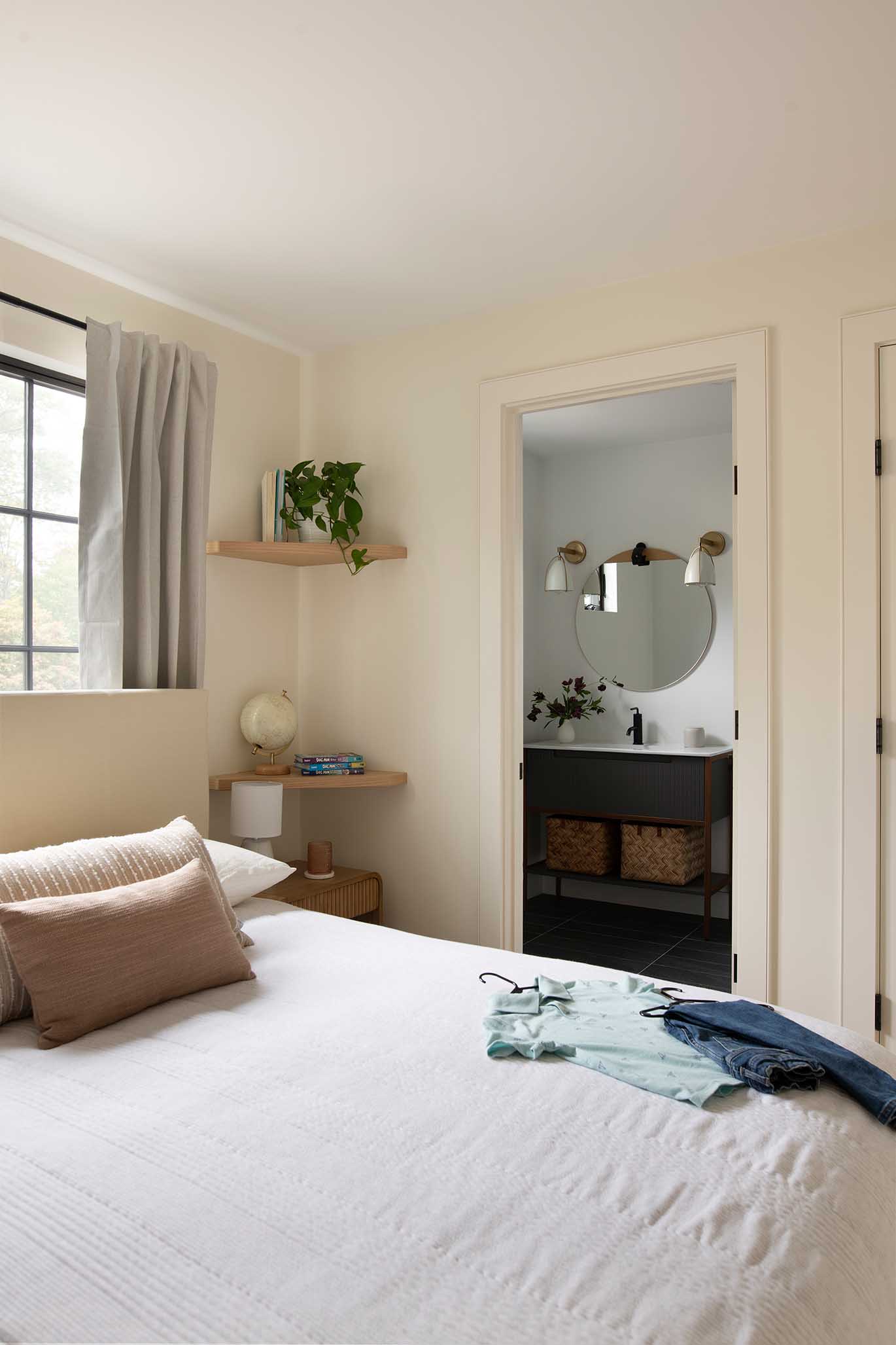 A peaceful and inviting guest bedroom layout, styled with neutral tones for a relaxing coastal feel.