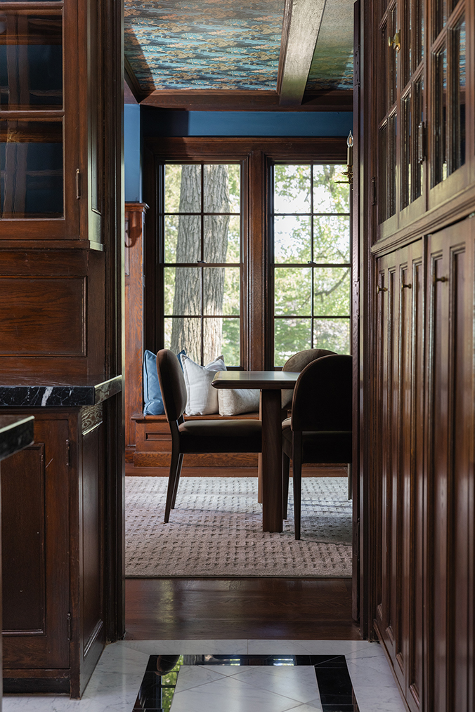 Narrow view through the original butler's pantry, connecting the dining room to the new kitchen.