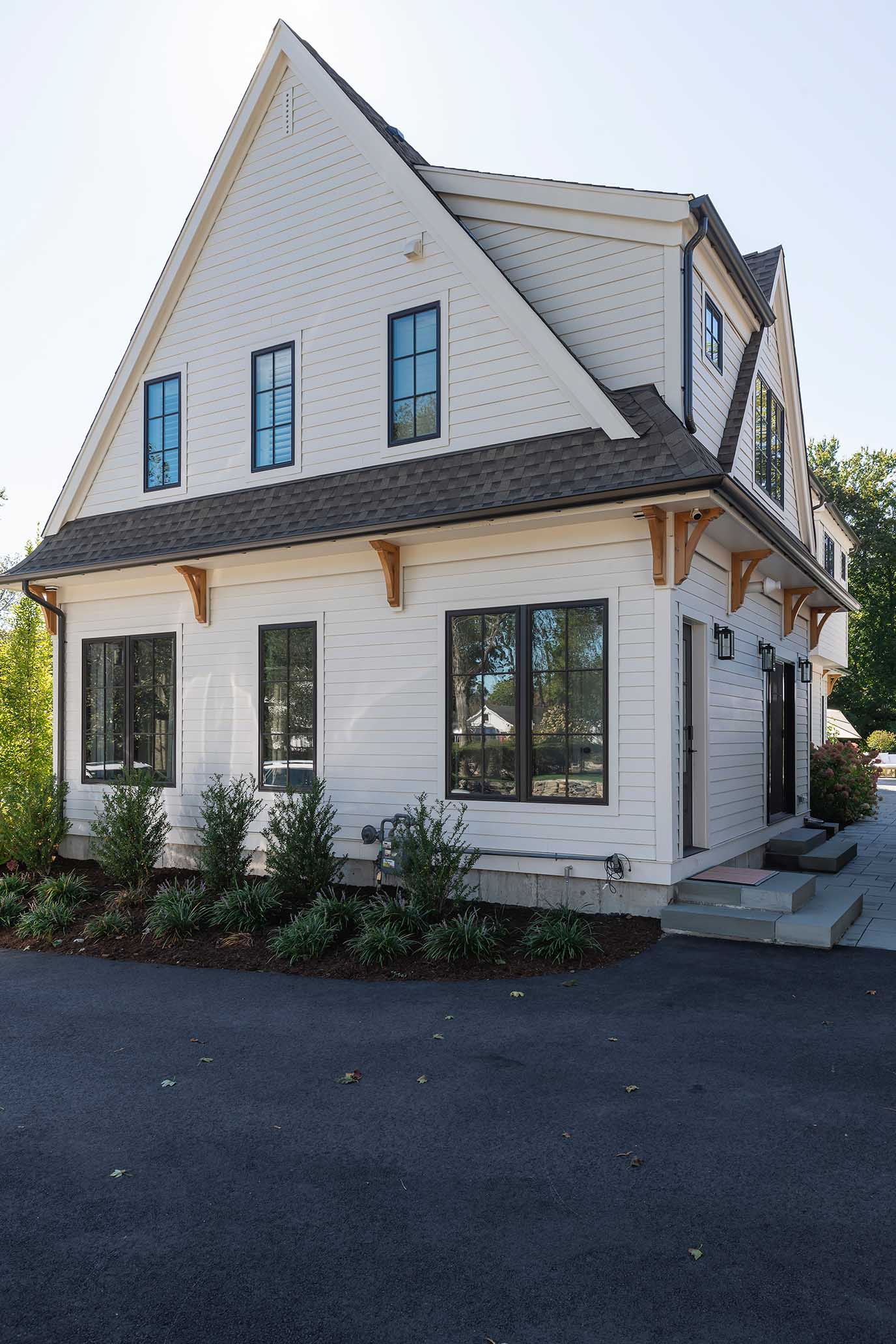 Side elevation of a new home built to meet Historic District Commission requirements, blending traditional forms with modern performance.