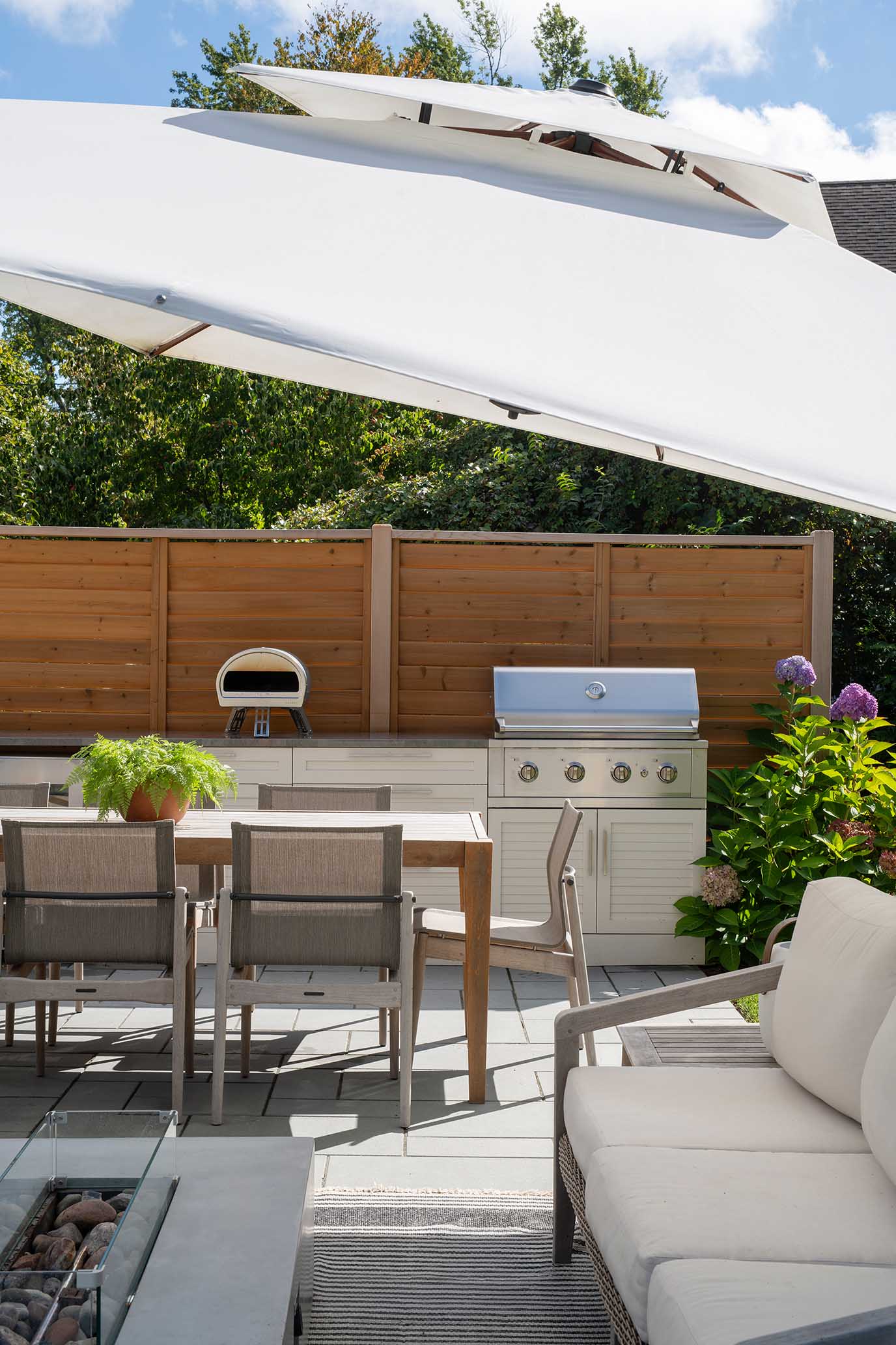 Custom outdoor kitchen and grill station designed for summer entertaining in Rhode Island.