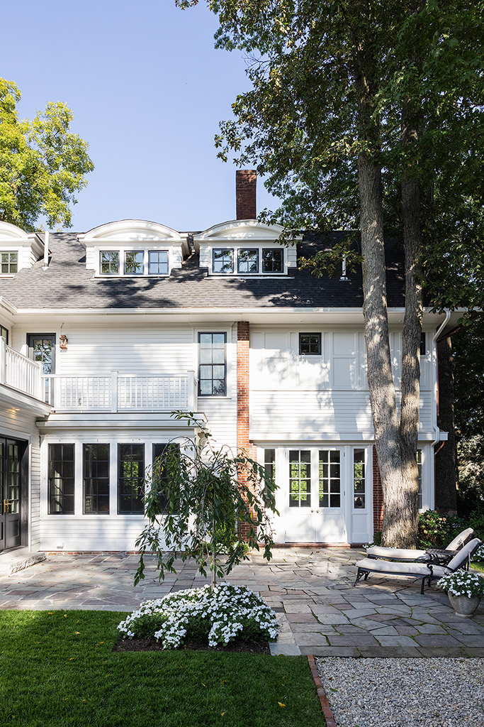 Straight-on view of the rear facade, showing the symmetry of the new addition.
