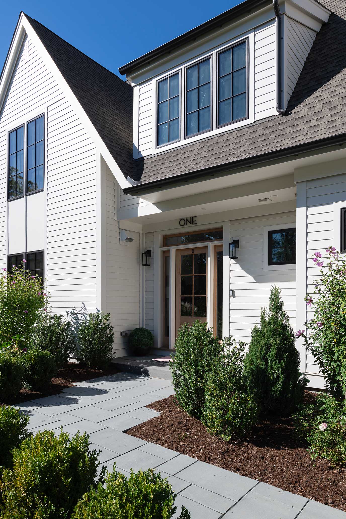 Bright, custom entryway featuring durable materials suited for coastal living, a hallmark of high-quality Rhode Island construction.